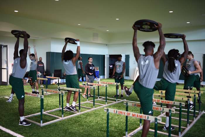 High-level athletes, like those on the Miami football team, usually work closely with trainers and staff. Now, they can only interact through a screen.
